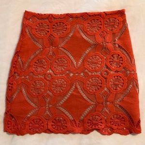 Red lace mini skirt with nude underlay